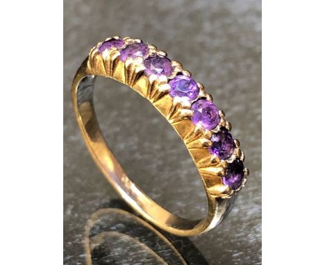 9ct Gold ring set with seven Amethyst stones size 'N'