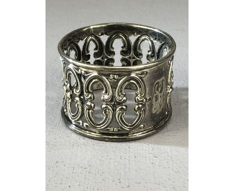 Marked Sterling 455 and with makers mark, a Silver ornate napkin ring