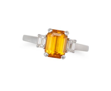 A YELLOW SAPPHIRE AND DIAMOND THREE STONE RING set with an octagonal step cut yellow sapphire of 2.00 carats, accented on eac