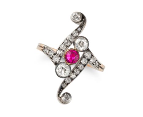 AN ANTIQUE SYNTHETIC RUBY AND DIAMOND DRESS RING in yellow gold and silver, in scrolling design set with a round cut syntheti