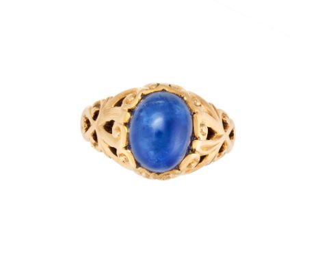 A SAPPHIRE DRESS RING in yellow gold, set with a cabochon sapphire of approximately 4.82 carats in an openwork mount, no assa