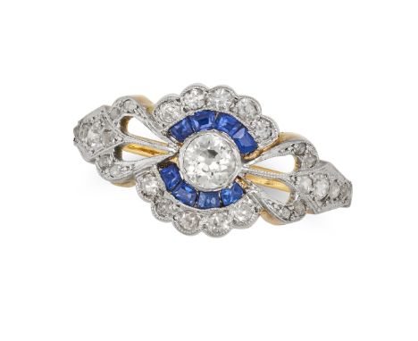 A SAPPHIRE AND DIAMOND DRESS RING in yellow gold, set with an old cut diamond in a border of calibre cut sapphires, accented 