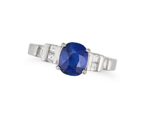 A SAPPHIRE AND DIAMOND RING set with a cushion cut sapphire of approximately 1.40 carats, the shoulders set with carre and ba