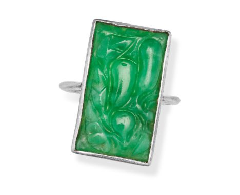 A JADEITE JADE RING in silver, set with a rectangular carved jadeite jade, no assay marks, size M1/2 / 6.5, 3.4g. 