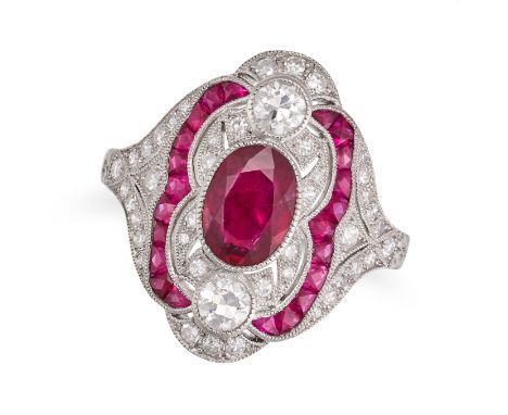 A RUBY AND DIAMOND DRESS RING set with an oval cut ruby accented by transitional and single cut diamonds and calibre cut rubi