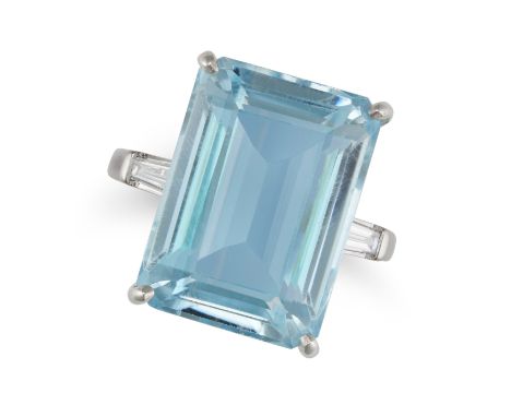 AN AQUAMARINE AND DIAMOND RING set with an octagonal step cut aquamarine of 21.60 carats accented on each side by a baguette 