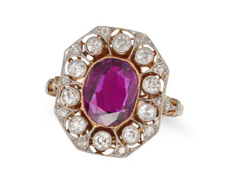 A FRENCH RUBY AND DIAMOND CLUSTER RING in 18ct yellow gold, set with a cushion cut ruby of approximately 2.25 carats in a bor