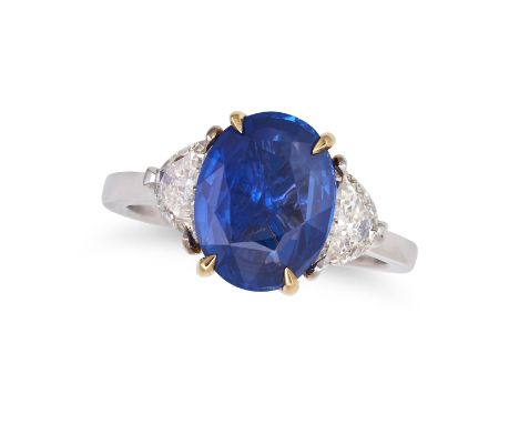 A SAPPHIRE AND DIAMOND THREE STONE RING set with an oval cut sapphire of approximately 3.19 carats accented on each side by a