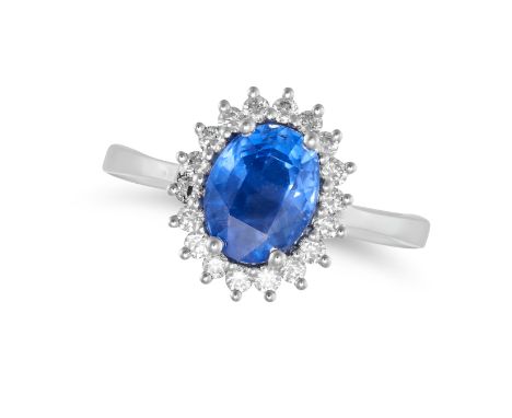 A BURMA NO HEAT SAPPHIRE AND DIAMOND CLUSTER RING set with an oval cut sapphire of 2.17 carats in a cluster of round brillian