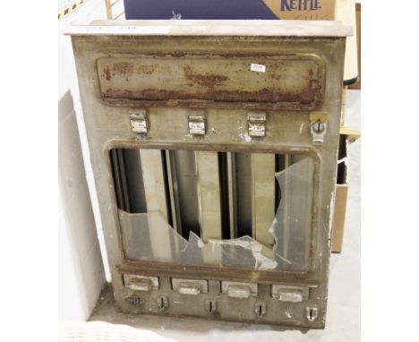 Vintage metal vending machine&nbsp;with four dispensers, the bottom left hand corner of the case with embossed initials 'TN' 
