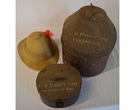 Possibly WWI Wolsey pattern pith helmet and case, plus one other 'G M Paget ESQ' Coldstream Guards