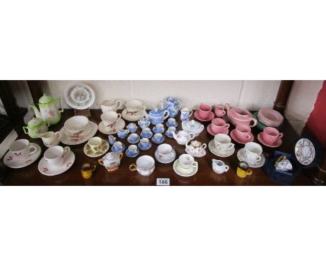 Shelf of miniature tea services to include Coalport