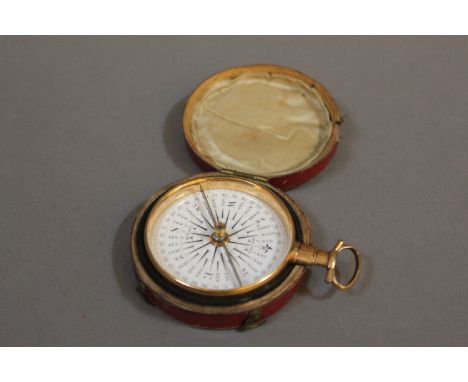 A Georgian pocket compass, thirty-two points, inscribed 'Dolland, London', gold plated, in original red leather case, 7.5cm h