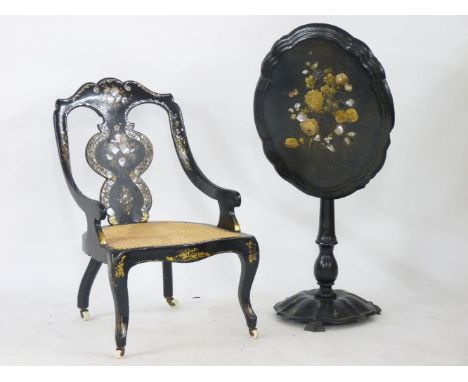 A Victorian papier mâché elbow chair, with mother of pearl insets, and a papier mâché pedestal table