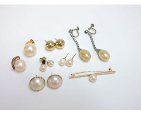A pair of 9ct gold mabé pearl stud earrings, a pair of gold cultured pearl stud earrings, a similar single earring, a matched