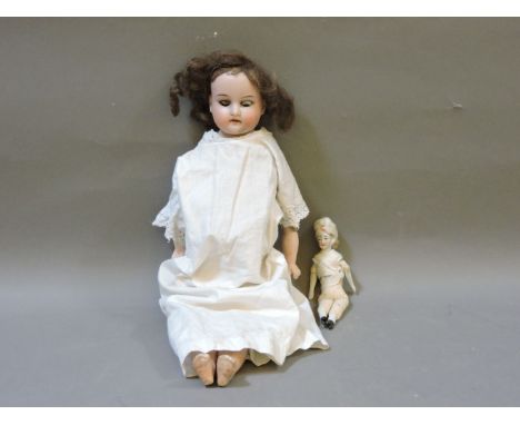 A ceramic doll with leather body, marked to neck AMG/O Dep 370, and another smaller example