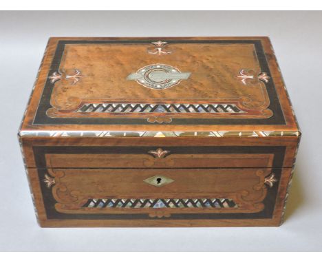 A Victorian walnut workbox, with inlaid mother of pearl and metal decoration, the interior with a fitted tray and some ivory 