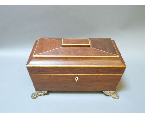 A George III hardwood and boxwood strung tea caddy, opening to reveal a bowl flanked with lidded compartments, 32cm wide