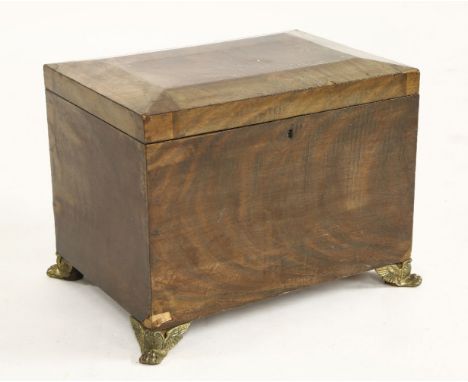 A 19th century mahogany cellarette, with a caddy top, raised on brass Egyptian revival winged bracket feet, 50cm wide