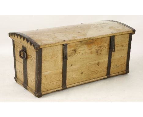 A Victorian stripped pine trunk, with domed top and metal mounts, 107cm long