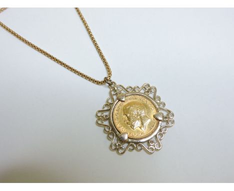 A full sovereign pendant, dated 1925, in a 9ct gold scroll mount on a popcorn chain, marked 750, 19.9g approximately