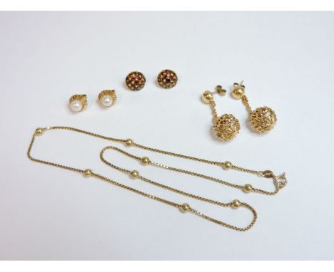 Two pairs of gold earrings, a pair of garnet earrings, and a gold box and lead chain, stamped 10k