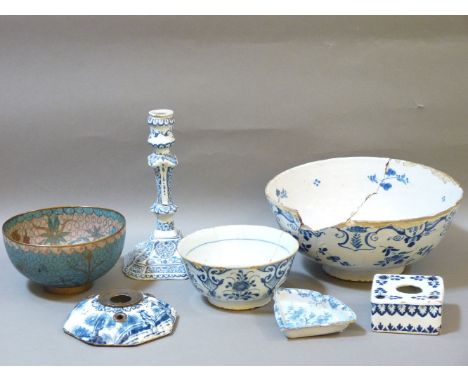 Blue and white Delft ware, including a bowl, 26cm diameter, a candlestick, 22cm, another bowl, 16cm, an inkstand, a segmental