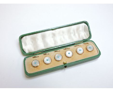 A set of six gilt metal and mother of pearl dress buttons, centred with a turquoise stone, in fitted presentation case