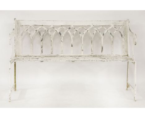 A white painted metal garden bench