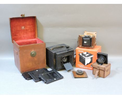 A Zodel-Reflex plate camera, cased lens and developing tank, and a Zeiss Ikon 35mm camera