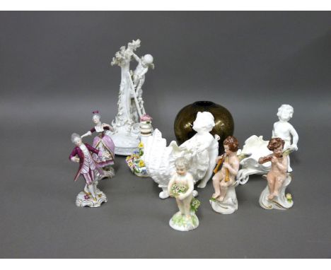 A quantity of ceramic figures, including cherub musicians, a scent bottle, etc