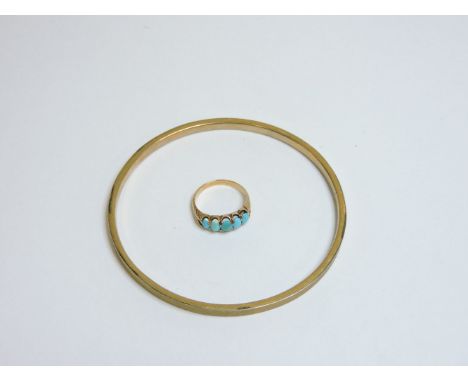 A 9ct gold slave bangle, and a turquoise five stone ring