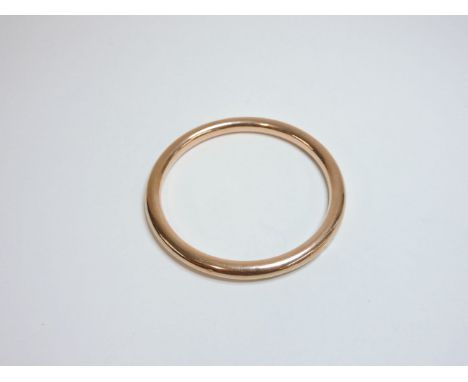 A hollow gold slave bangle, marked 9c, by Henry Griffiths & Sons
