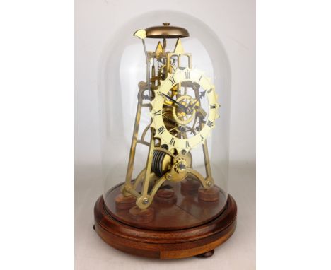 20th century Gothic style brass skeleton clock, with shaped white enamel Roman chapter ring and single fusee movement, on cir