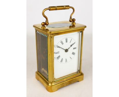 Early 20th century brass carriage timepiece with white enamel Roman dial,plain case with bevelled glass panels, H14cm   Condi