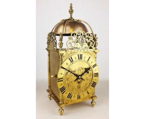 20th century brass lantern clock in 17th century style, scrolled dolphin crestings, engraved decoration, encased barrel movem