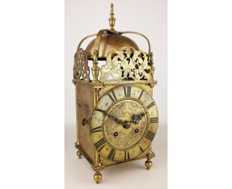 18th Century brass lantern clock with strap work bell supports, pierced frets and Roman chapter, later twin train movement st