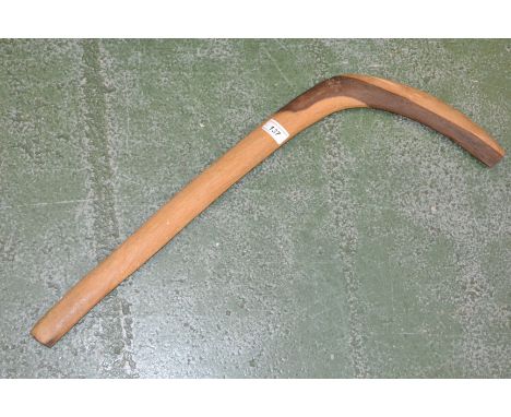 Tribal Art - an Australian Aboriginal two-tone hardwood leangle type boomerang or hunting stick, 66cm long 