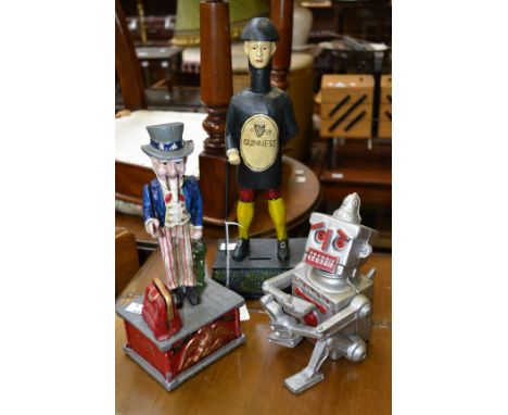 A cast metal Robert the Robot money bank; a cast metal Uncle Sam money box; a Guinness man money bank. (3)