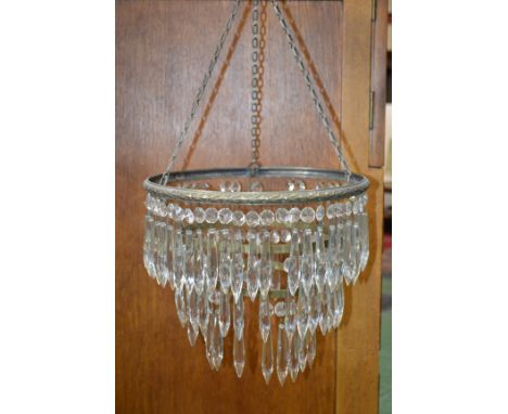 An Early 20th century cut glass triple ring droplet light shade, case brass coloured rings, cast floral principle ring, 