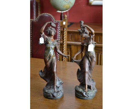 A spelter figure of a classical lady with a puppet, singed to base C.H.Ruchot, another similar holding a tambourine (2)