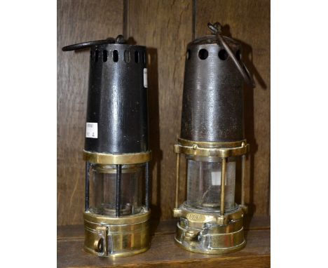 A 19th century brass and steel miner's lamp, pierced canopy, stamped number 1746, 25cm high; another, by Richard Johnson, Cla
