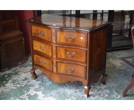 A reproduction Dutch serpentine commode, flame mahogany quarter veneered top, three drawers, brass escutcheons and handles.