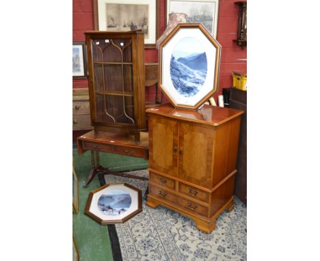 A small yew wood sofa table, two drawers to frieze; a floor standing corner cupboard, canted angles, astragal glazed door; a 