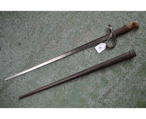 A 19th century French bayonet and scabbard, wood and brass handle, c.1877