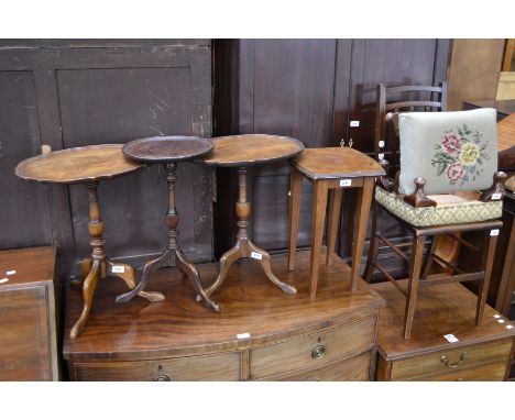 A pair of mid 20th century reproduction mahogany wine tables; a George III style mahogany wine table, tripod base; a pair of 