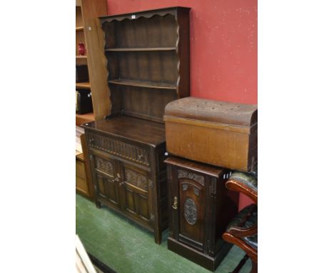 A small dark oak priory style dresser; an Edwardian mahogany pot cupboard, brass drop handle, a tin trunk (3)