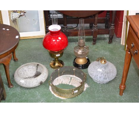 Lighting - A Victorian oil lamp; another later; a brass pieced ceiling light shade with tassels; other early 20th century gla