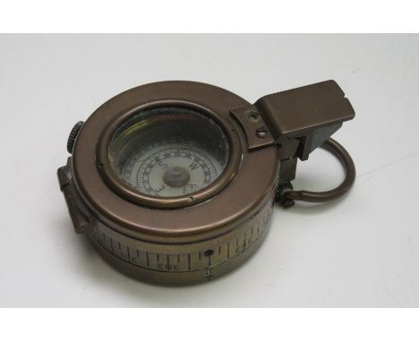 A WWII brass military compass, T.G &amp; Co Ltd, London, dated 1941, MKIII, diameter 6cm.