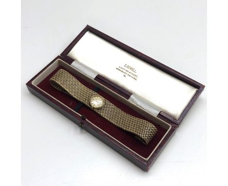 A ladies 9ct gold Jaeger-leCoultre with patent winding, the case numbered 8748 on broad gold mesh bracelet, 39.5g.